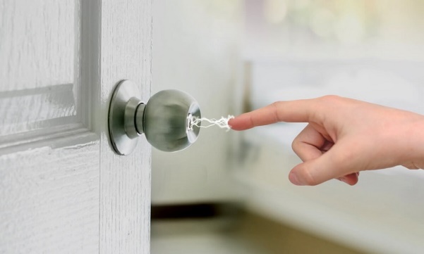 A picture containing metalware, person, door handle, indoor Description automatically generated